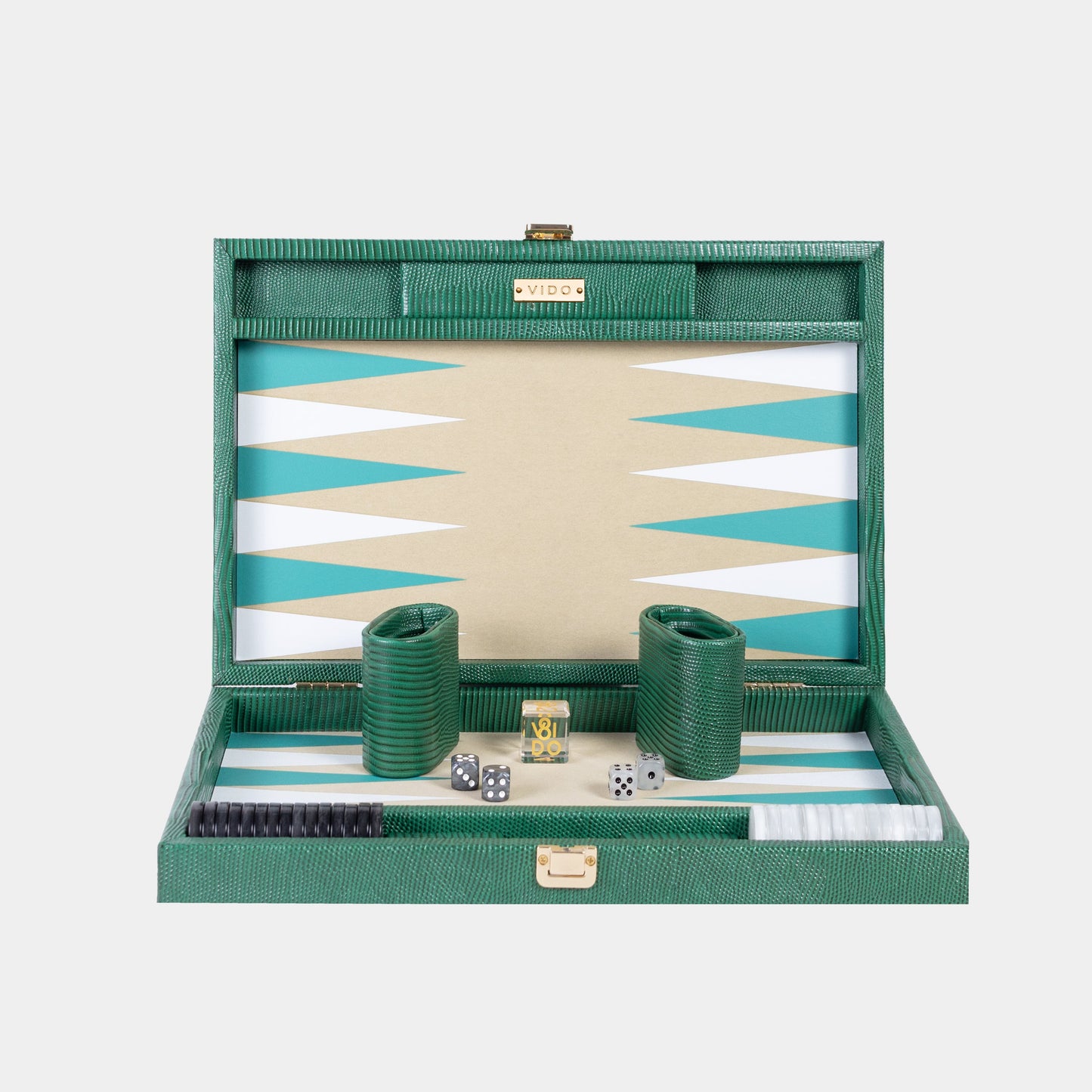 Green backgammon set with dice and pieces on a white background by VIDO