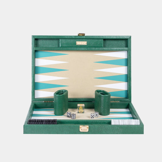 Green backgammon set with dice and pieces on a white background by VIDO