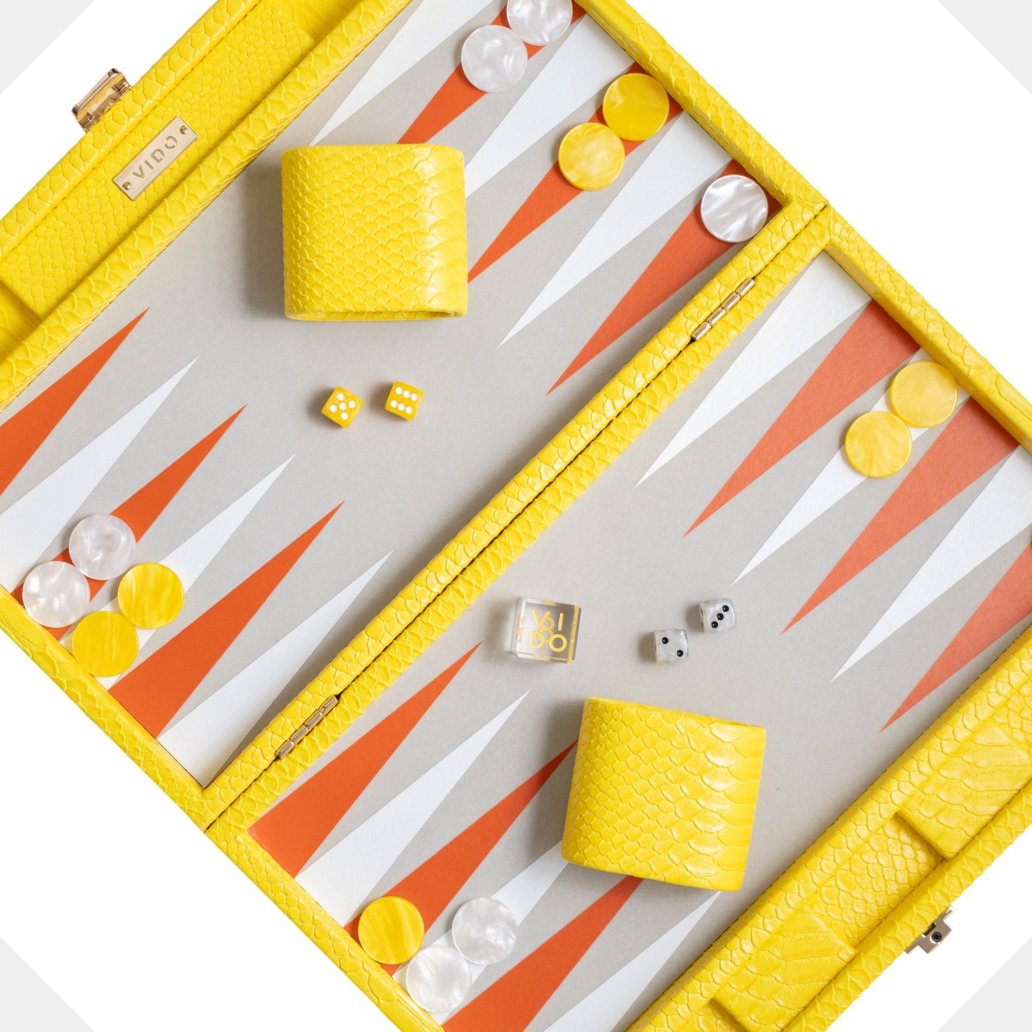 Backgammon set with yellow and white pieces on a white background by VIDO